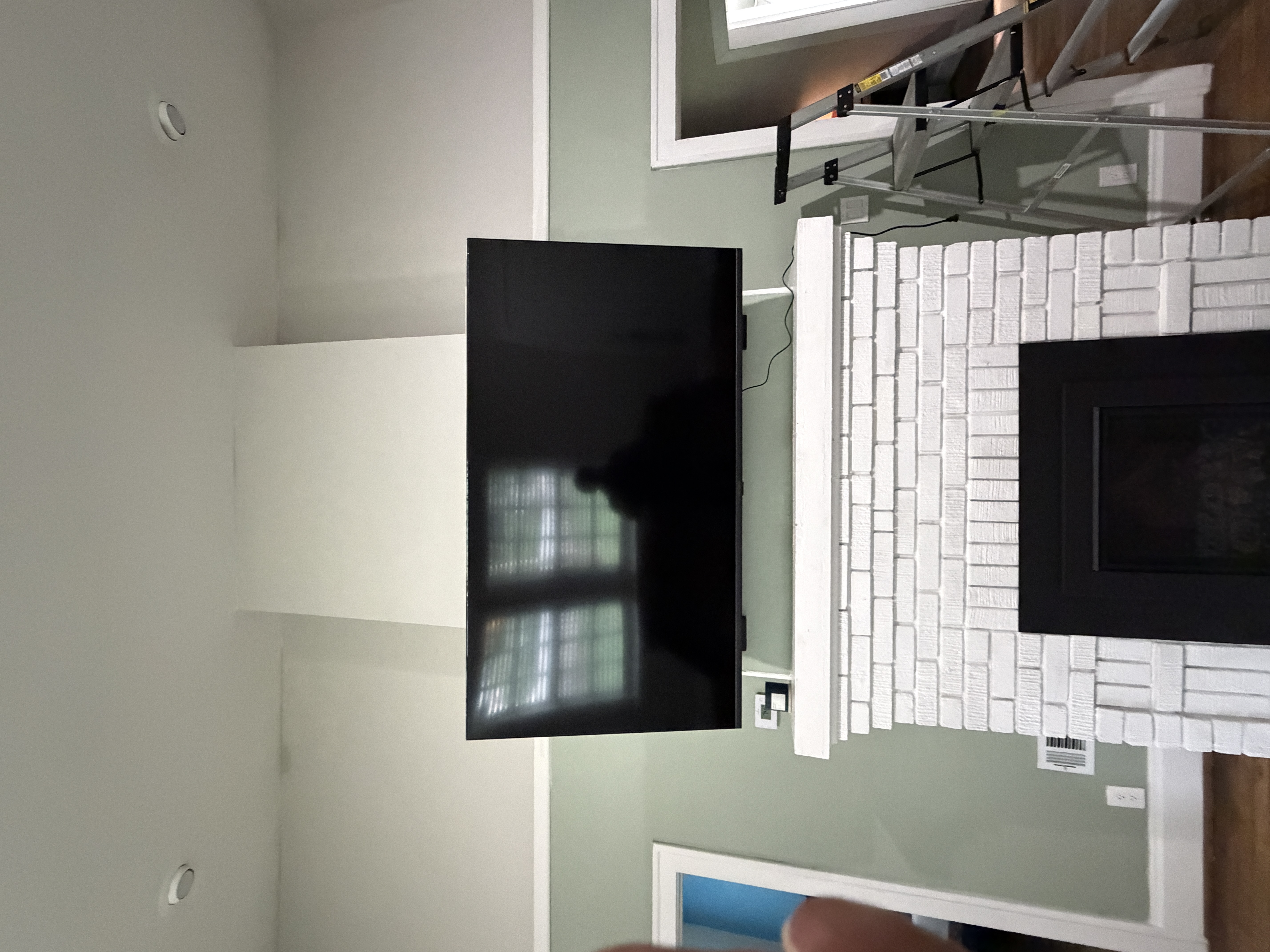 Brick Fireplace Mount by PureShine Handyman Services in North Atlanta