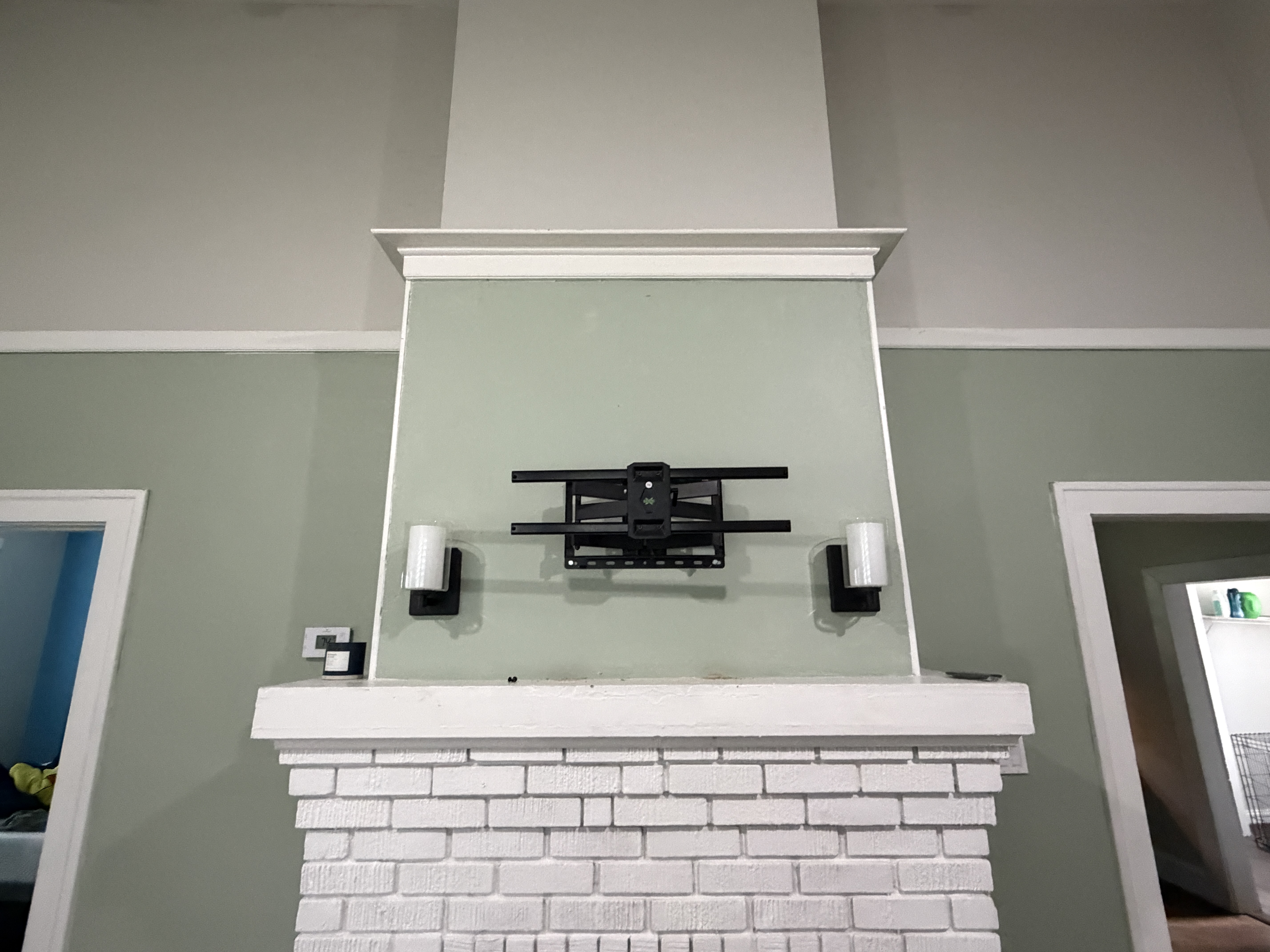Flat-screen TV professionally wall-mounted in a modern Alpharetta living room with hidden cords